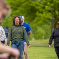 Two participants smile and laugh